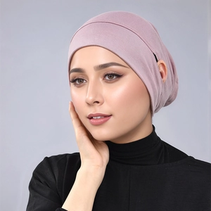Detail of mauve modal hijab undercap featuring practical ear hole for glasses or earphones