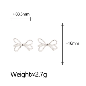 Detailed view of clear bead bow earrings with dimensions 33.5mm by 16mm and weight 2.7g