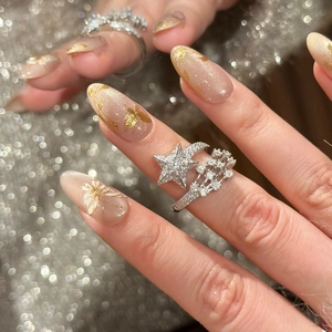 Elegant silver star open ring with cubic zirconia crystals worn on index finger