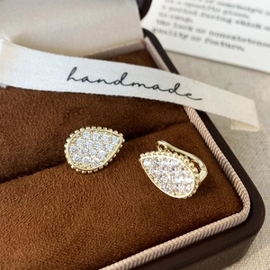 Luxury gold plated pear-shaped hoop earrings with sparkling cubic zirconia pavé stones