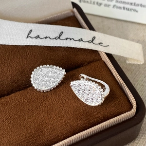 Sparkling teardrop stud earrings with pavé crystals in silver finish and a gift box