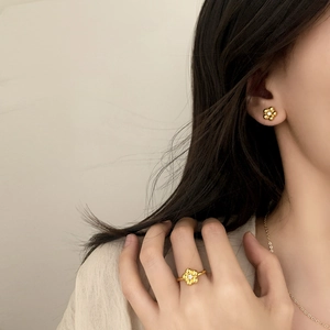 Elegant gold flower jewelry set including studs and ring with small center zircons
