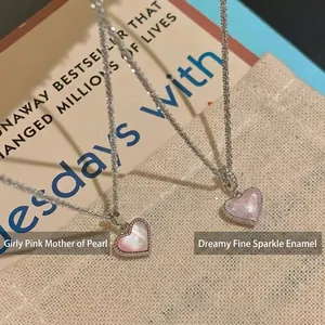Pink heart necklaces featuring natural shell and sparkling enamel on silver chains