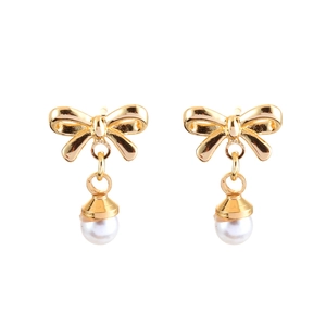 Elegant gold bow earrings featuring white pearl drops on a minimalist white background