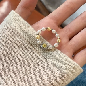 Elegant pearl beaded ring featuring a square yellow gemstone with pavé crystal accents