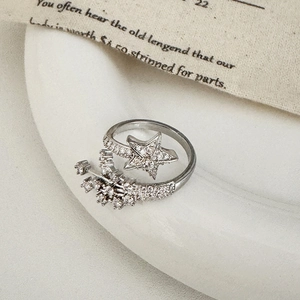 Macro detail of silver star opening ring featuring sparkling zircon pavé craftsmanship