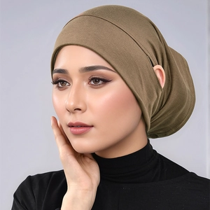 Detail of olive green modal jersey hijab cap with innovative ear openings for glasses