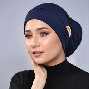 Close-up of premium modal hijab inner cap in navy blue with elastic ear opening detail