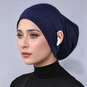 Detail of dark blue modal inner hijab cap featuring hidden side slits for earphone access
