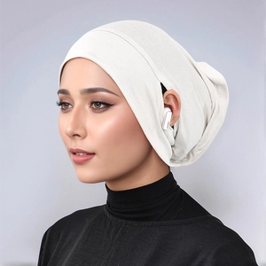 Detailed side view of white modal inner hijab with ear openings for wireless earbuds