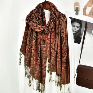 Close-up of bohemian paisley shawl showing fringe details and vintage patterns