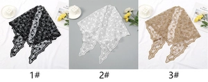 Detailed close-up showing black, white, and brown floral lace scarves with scalloped edges