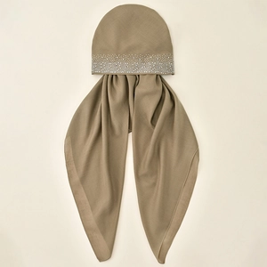Close-up of khaki turban hijab with rhinestone embellishments and fine fabric texture