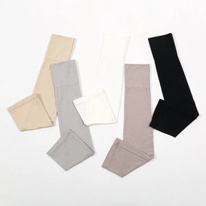 Detail view of five assorted color arm sleeves with wide anti-slip cuffs on white background