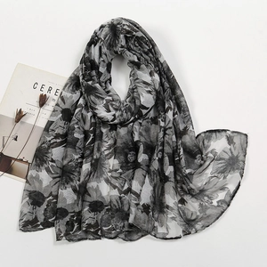 Detail of soft black and white floral print voile scarf with lightweight semi-sheer texture