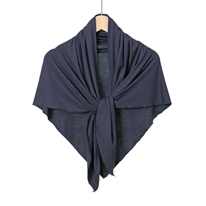 Detail of dark blue mercerized cotton headscarf with fine knit texture on wooden hanger
