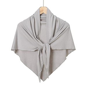 Close-up of soft light gray mercerized cotton triangle scarf with knitted texture detail