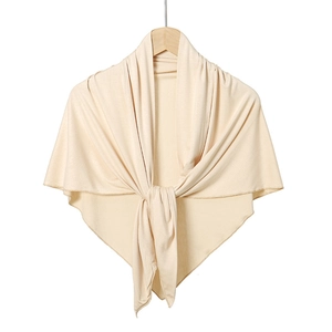 Detail of soft cream mercerized cotton triangular scarf with elegant cross-knot design