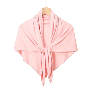 Detailed view of pink soft mercerized cotton headscarf tied neatly on a wooden hanger