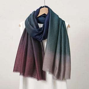 Gradient ombre pashmina scarf in blue green purple shades with frayed edges on hanger