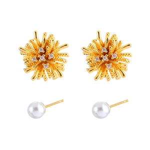 Sparkling zircon firework studs and classic pearl earrings in elegant gold finish