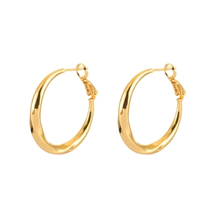 Minimalist gold irregular twisted hoop earrings with a smooth polished finish on white background