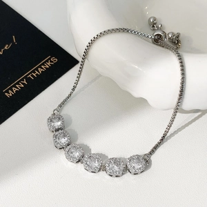 Detail of adjustable silver bracelet with square cubic zirconia and slider clasp