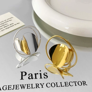 Polished minimalist metallic open rings in gold and silver finish with abstract design