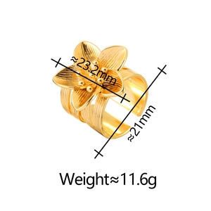 Detail view of the golden flower ring showing petal size and multi-layer band dimensions