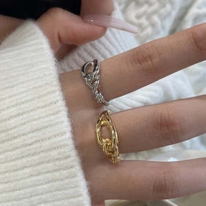 Minimalist knotted chain ring set in gold and silver finish shown on fingers