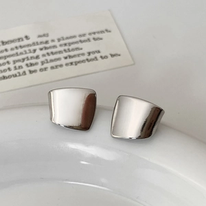 Minimalist silver irregular square stud earrings with high-polish mirror finish effect