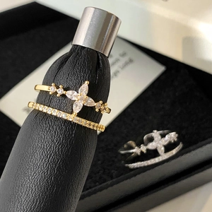 Gold and silver double-layered open rings with sparkling crystals and star motifs