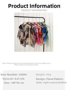 Detail of colorful floral printed voile scarves showing light translucent fabric texture