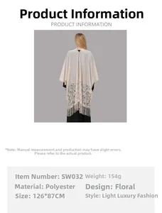 Detail of floral lace pattern and tassel hem on beige polyester shawl for women