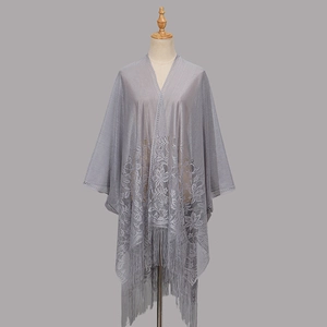Elegant grey floral lace shawl with tassel hem shown on a mannequin in a longline fit