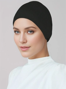 Detail view of black mercerized cotton hijab undercap showing elastic knit fit and texture