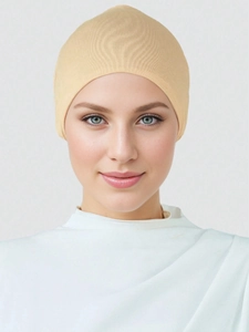 Close-up of the fine elastic knit texture on this beige mercerized cotton hijab cap