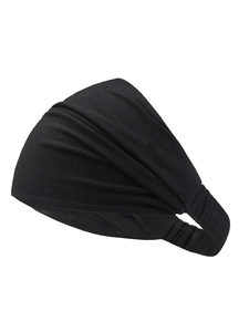Close-up of black wide elastic headband showing soft knitted texture and natural pleats