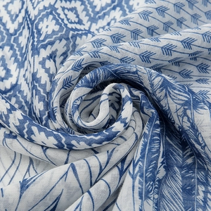 Blue geometric floral cotton linen scarf featuring bohemian leaf patterns and soft fringes