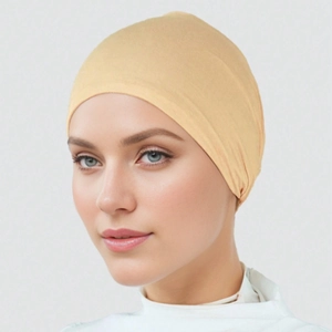 Beige mercerized cotton inner hijab cap with tie-back design shown on model portrait