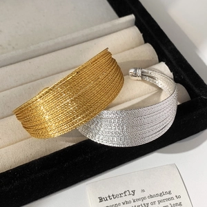 Luxurious woven textured open cuff bracelets in gold and silver finishes for women