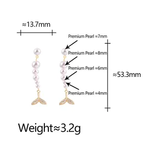 Elegant gold fishtail earrings with long pearl tassels and sparkling cubic zirconia details