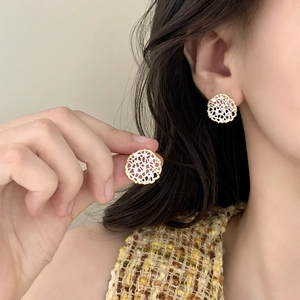 Elegant gold and silver hollow lace stud earrings featuring a vintage French aesthetic