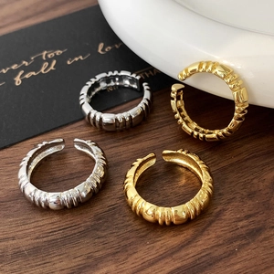 Set of four minimalist spiral textured open rings in gold and silver finish for women