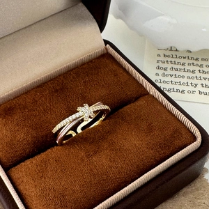Elegant gold cross ring with cubic zirconia and star detail in velvet box