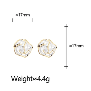 Elegant gold hollow flower stud earrings measuring 17mm with detailed metallic texture