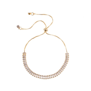 Minimalist gold adjustable bracelet featuring a row of baguette-cut cubic zirconia stones