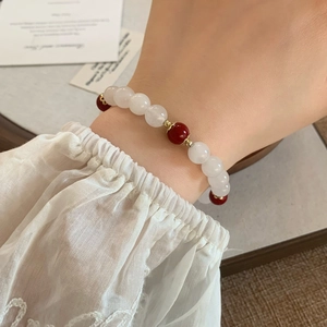 Vintage red and white natural stone beaded bracelet with elegant gold accents