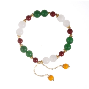 Elegante bracciale con calcedonio verde, pietre colorate e dettagli in metallo dorato