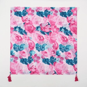 Ethnic floral print square scarf with pink fringe tassels on a clean white background